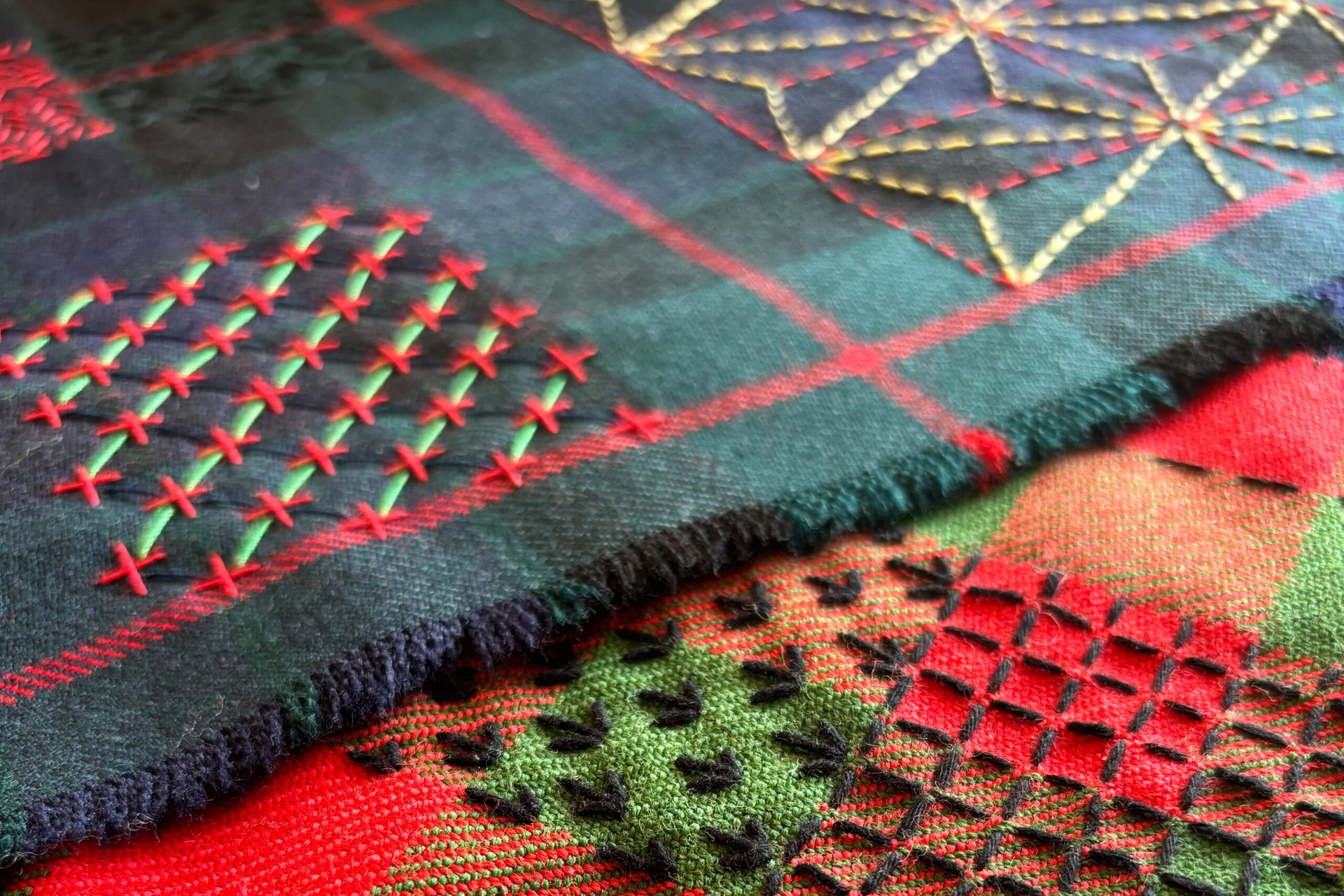 Decorative and colourful stitching sample on a kilt fabric.