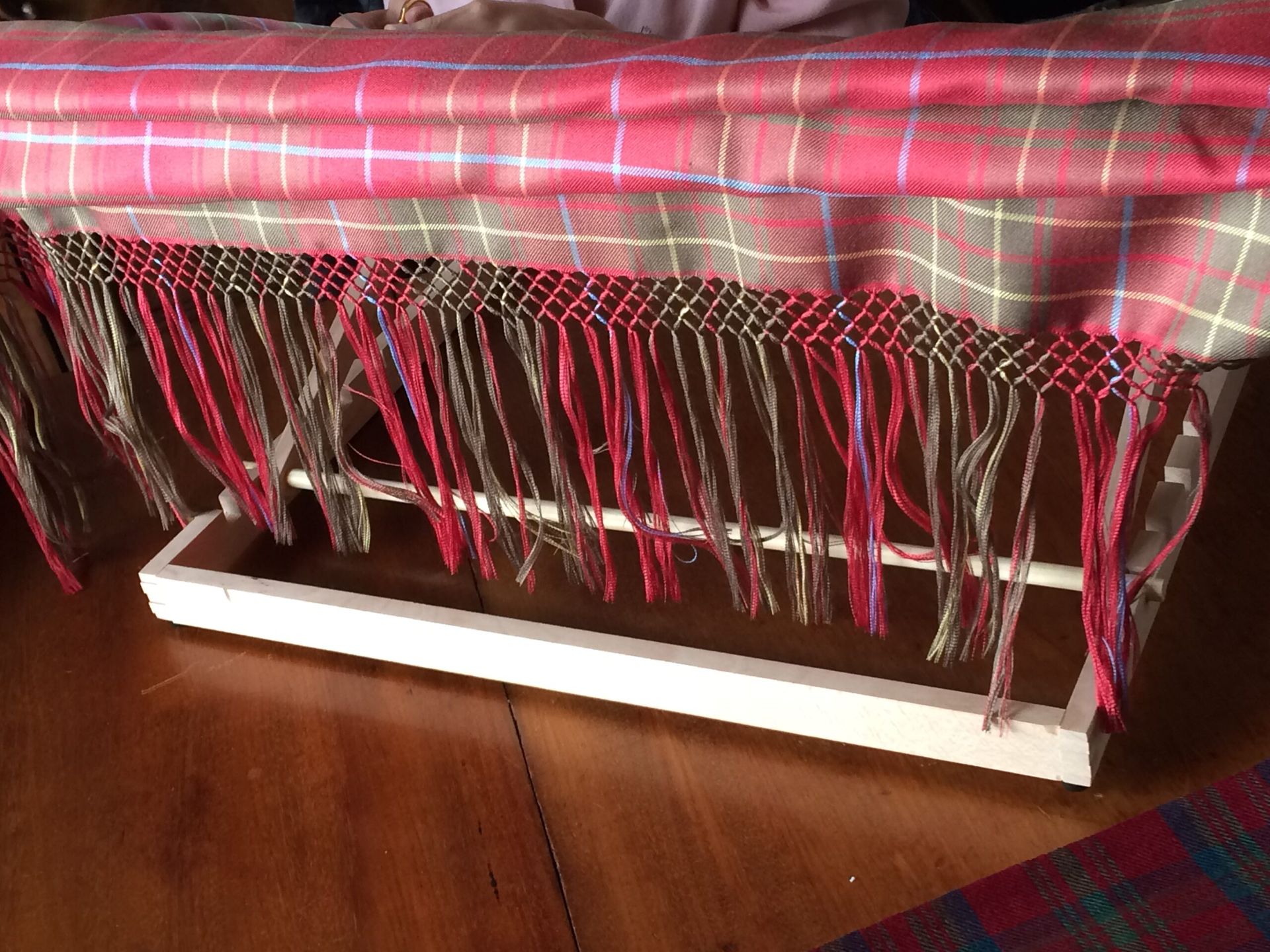 A picture shown a sample of silk knotting tartan example at the College of Master Kilt Tailors